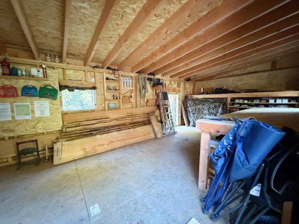 Lot: 48 - WOODLAND AND FORESTRY BUILDING - Forestry building interior with windows and access to back